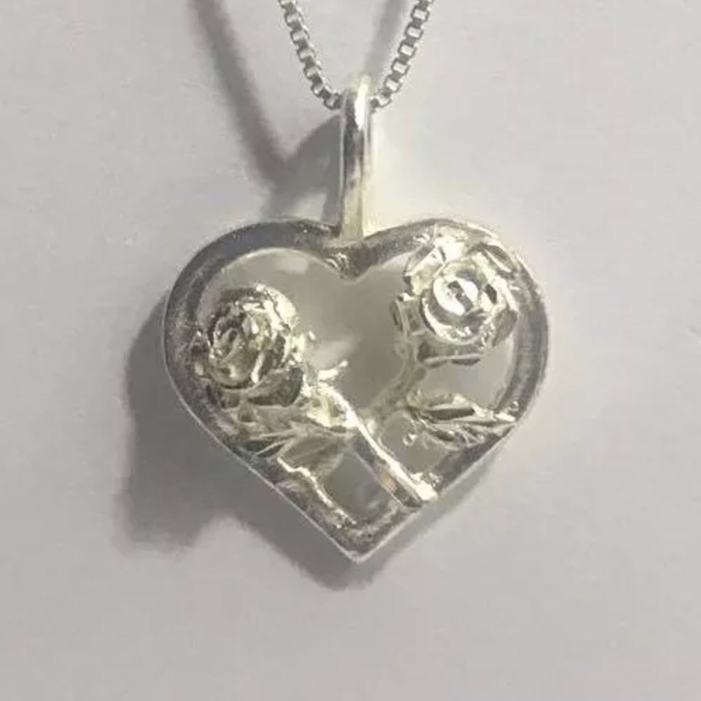 Sterling Silver Two Roses Crossed on a Heart